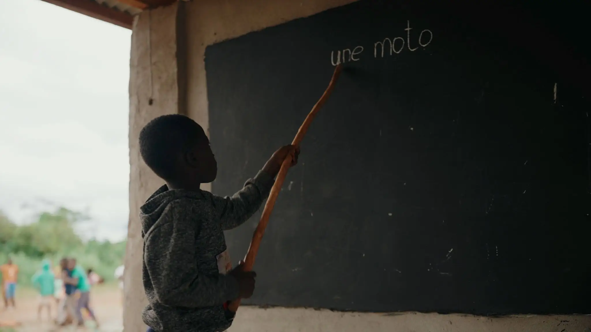 Student in a project school practices reading