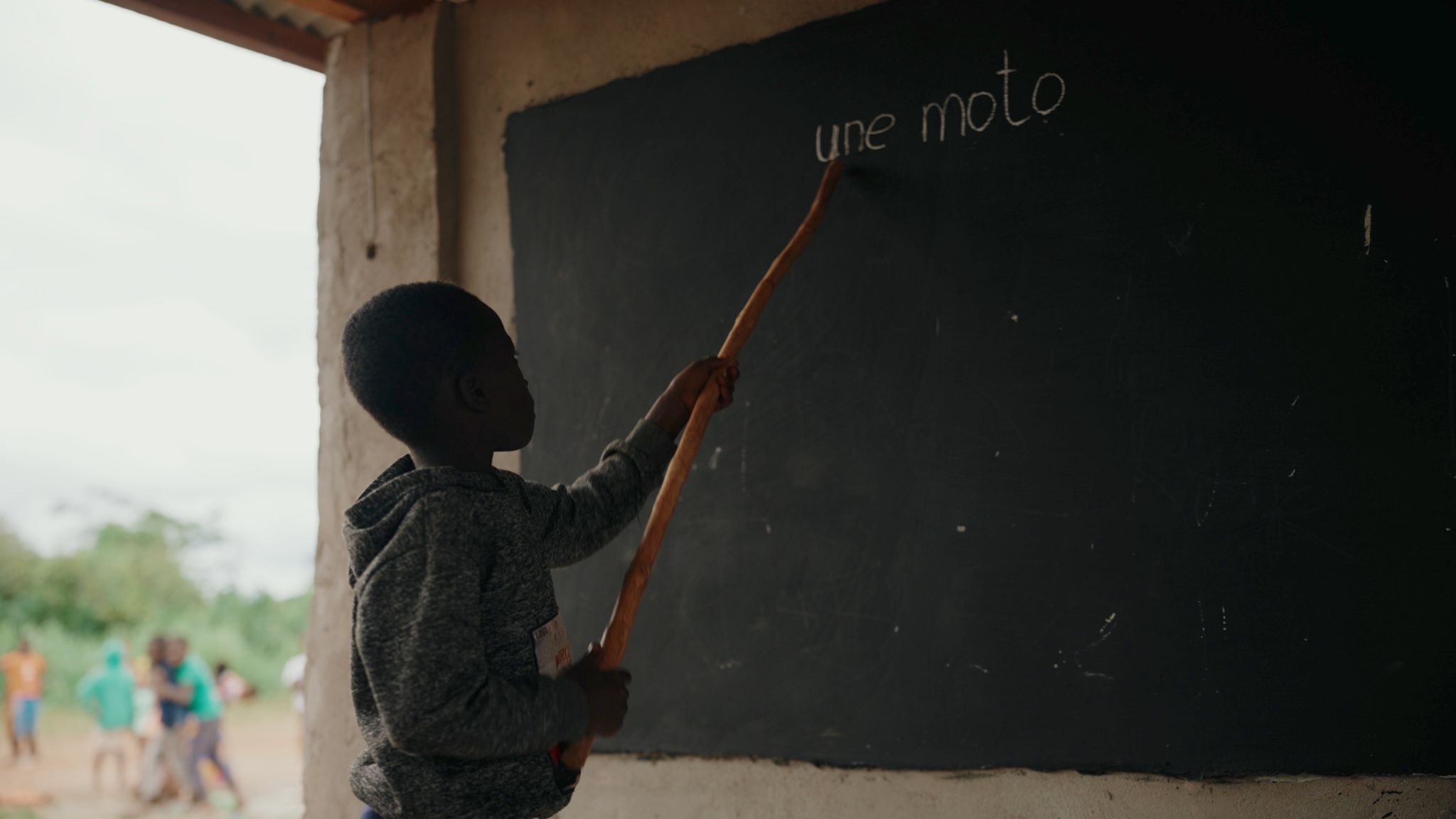Student in a project school practices reading